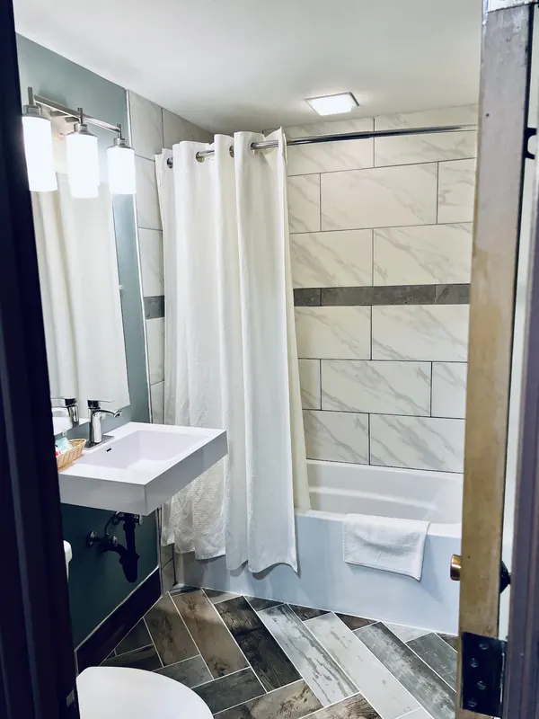 Bathroom with marble-look tile and basin